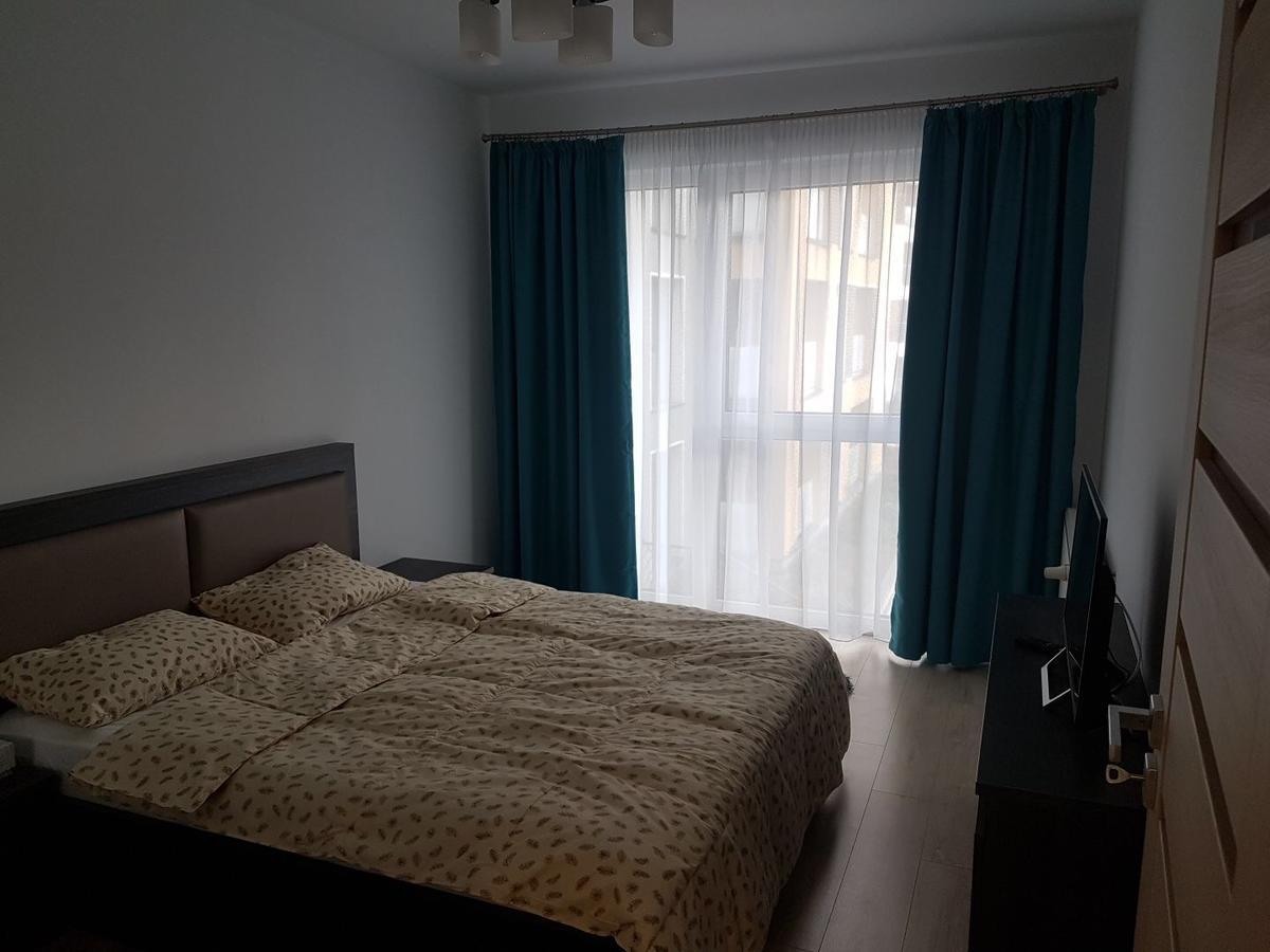 Hotel Platinia Kolozsvár Kültér fotó A bedroom in a typical apartment